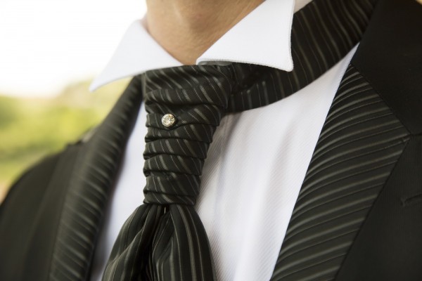 Groom in elegant black dress