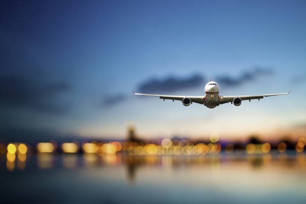 perspective view of jet airliner in flight with bokeh background