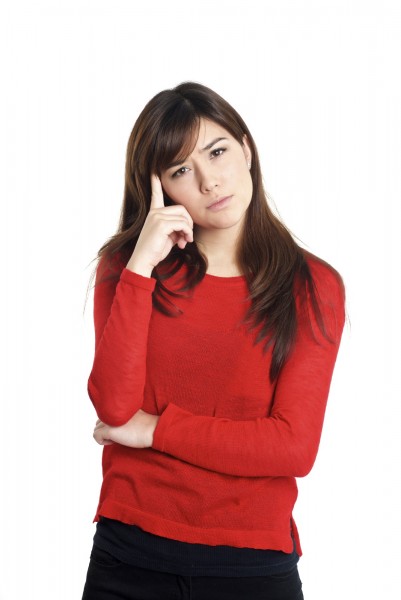 Questioning hand gesture woman in red on white background