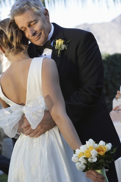 Father (facing camera) and bride dancing