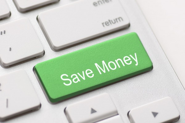 save money for investment concept with a green button on computer keyboard