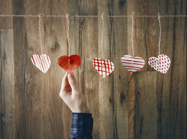 Paper hearts on wooden background. Love, Valentine Day concept.