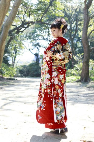 Woman wearing Japanese kimono in the forest.
