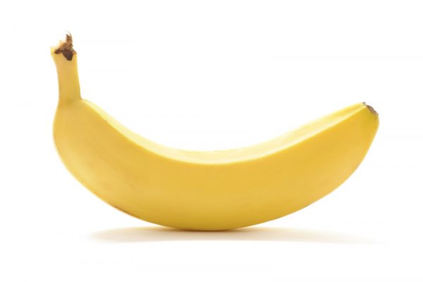 Yellow banana isolated on white background. With shadow.