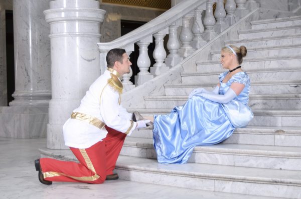 Cinderella and Prince Charming sitting on staircase.