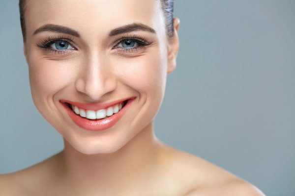 Woman smile. Teeth whitening. Dental care.